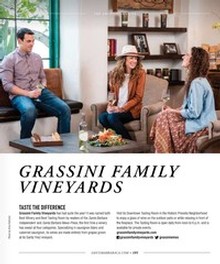 Photo of three sitting and enjoying food and wine in the Grassini Tasting Room
